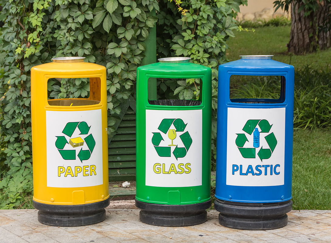Three multicolored recycle bins for waste with icons for the sorting junk waste.